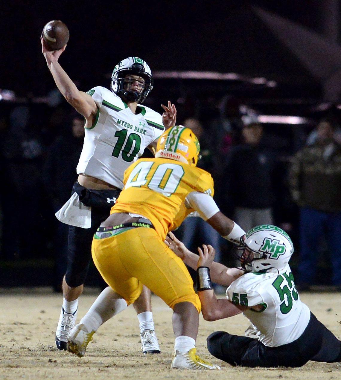 Myers Park quarterback Drake Maye (left) throws a pass during the 2019 season. In March, Maye de-committed from Alabama and verbally committed to North Carolina. He will be a senior in 2020.