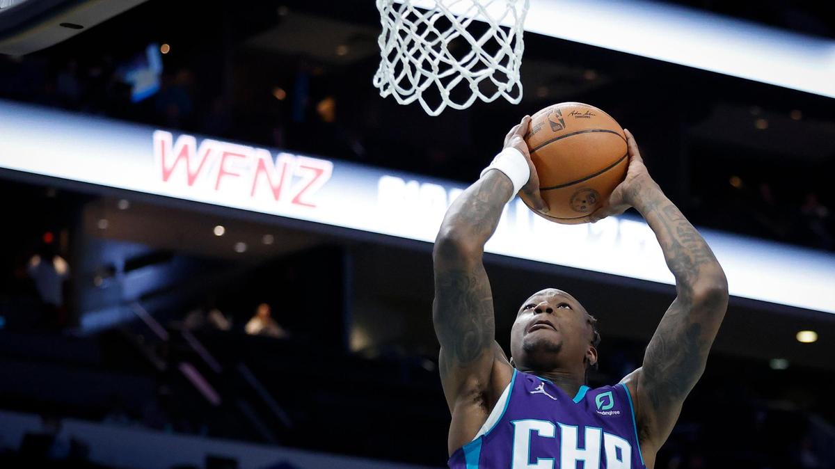 Charlotte Hornets guard Terry Rozier (3) slam dunks the ball over Brooklyn Nets defense during a game at the Spectrum Center in Charlotte, N.C., Tuesday, March 8, 2022. Brooklyn beat Charlotte 132-121.