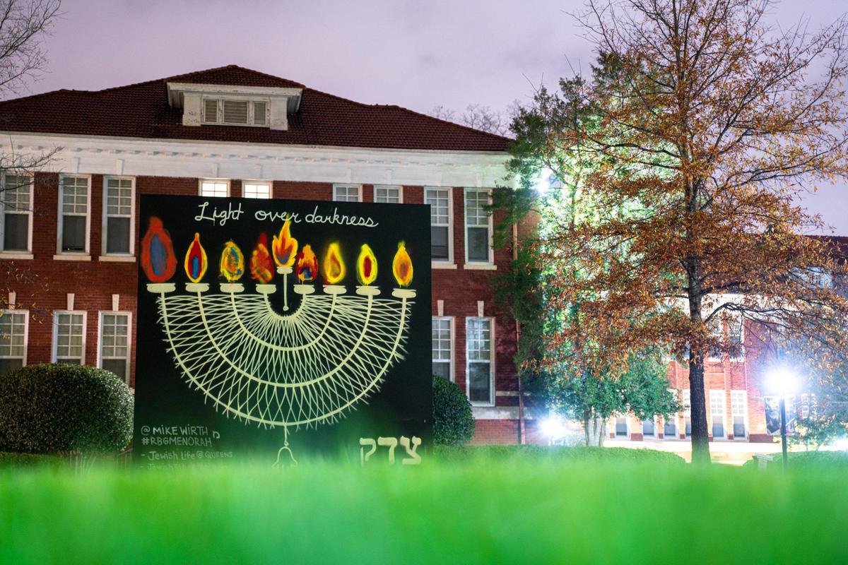 The Chanukah menorah in front of Queen’s University was created by Mike Wirth and is painted to resemble Ruth Bader Ginsburg’s dissent collar. Every night, a different community leader adds a painted flame.