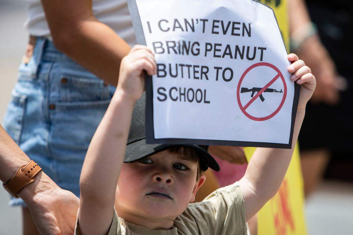 Many parents were accompanied by their children at the March for Our Lives event at First Ward Park in Charlotte, N.C., on June 12, 2021. Each parent wanted to build a safer world for their children.