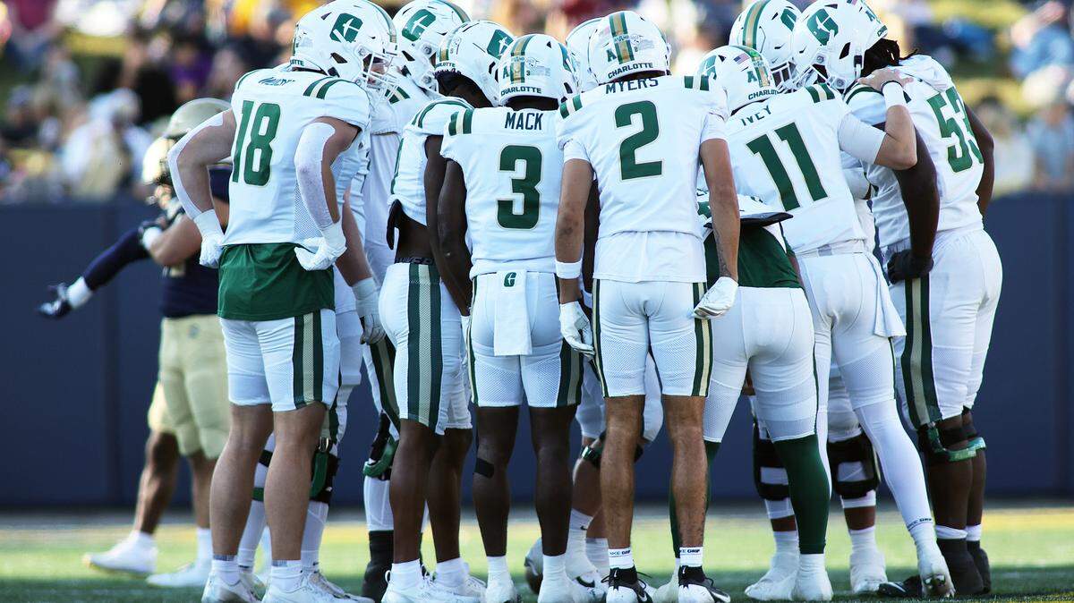Oct 19, 2024; Annapolis, Maryland, USA; Charlotte 49ers players huddle up during the second half against the Navy Midshipmen at Navy-Marine Corps Memorial Stadium.