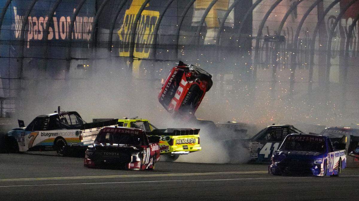 Feb 16, 2024; Daytona Beach, Florida, USA; NASCAR Truck Series driver Taylor Gray (17) gets flipped upside down during a wreck during the Fresh From Florida 250 at Daytona International Speedway.
