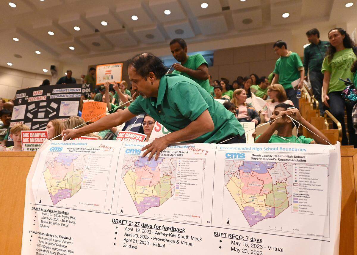 Signs were prevalent amongst the parents attending the Charlotte-Mecklenburg Board of Education meeting on Tuesday, June 6, 2023 where the south Charlotte boundaries vote was on the agenda.