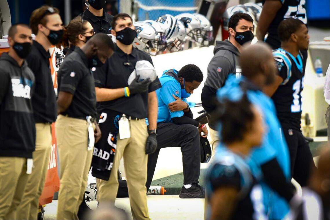 Injured Panthers quarterback Teddy Bridgewater takes a knee during the National Anthem on the team’s sideline on Sunday, November 22, 2020.