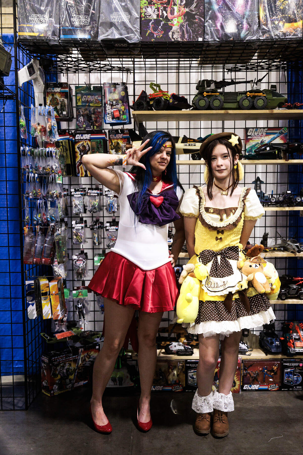 Mother and daughter Christina Jenkins (left) and Amelie Jenkins cosplay Sailor Mars from “Sailor Moon” and Pompompurin from “Hello Kitty” at Heroes Convention on Friday, June 12, 2026 at the Charlotte Convention Center.