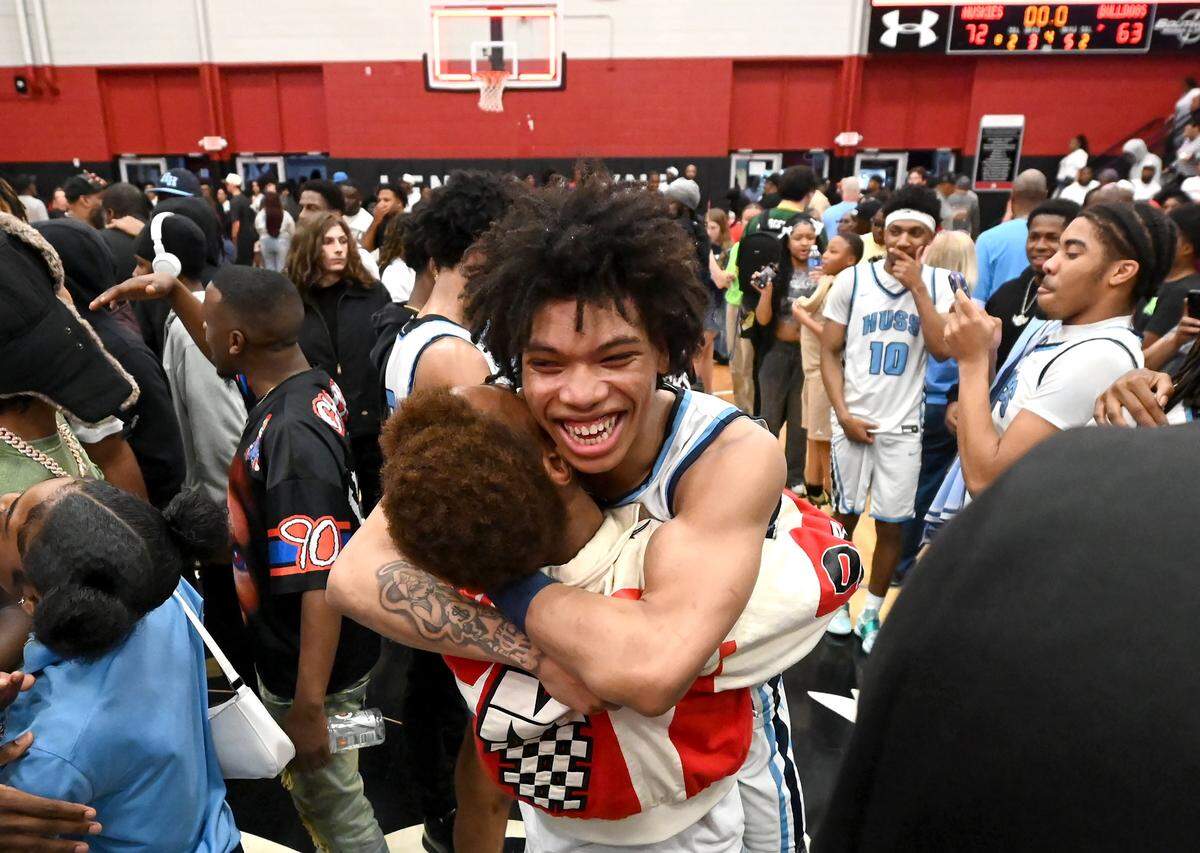 Hunter Huss Huskies Jaleel Smith celebrates the team’s 72-63 victory over Jay M. Robinson in the boys 5A NCHSAA regional championship game at Lenoir-Rhyne University in Hickory, NC on Saturday, March 7, 2026. 