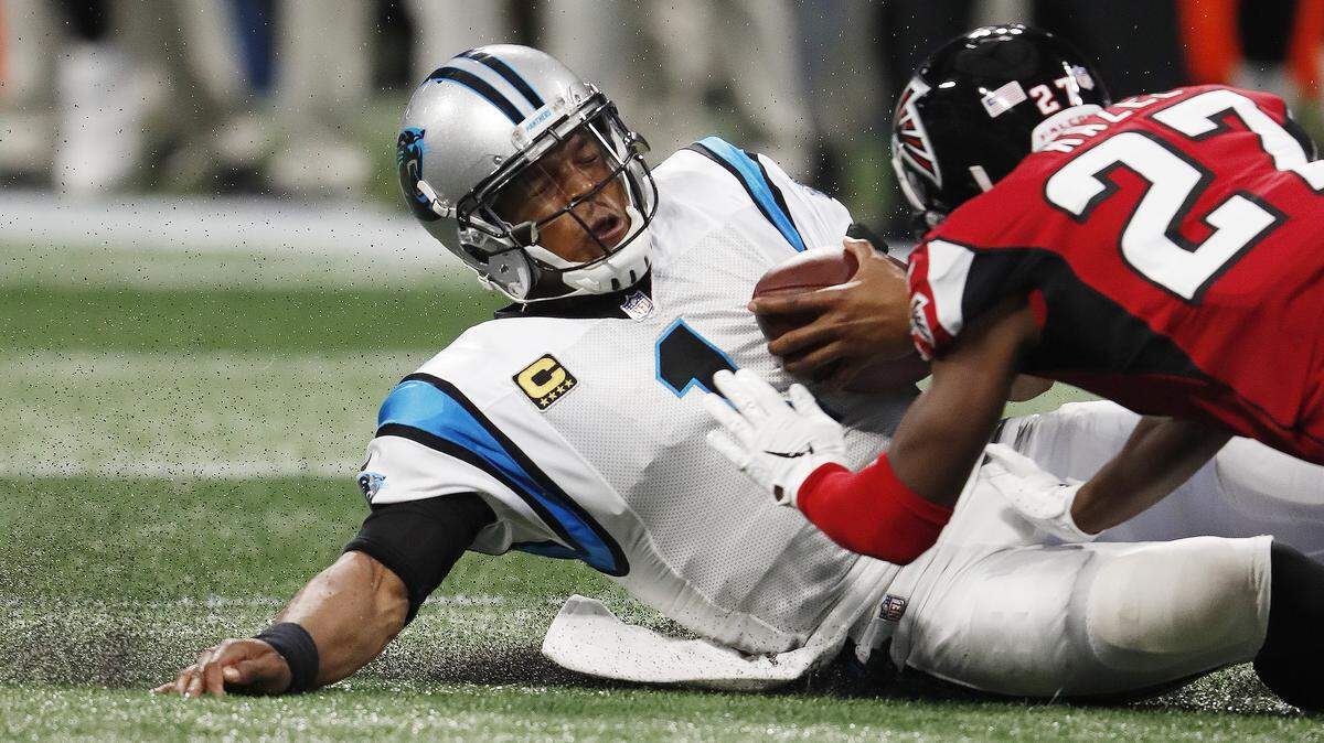 Atlanta Falcons cornerback Damontae Kazee (27) prepares to hit Carolina Panthers quarterback Cam Newton (1) during the second quarter on Sunday in Atlanta. Kazee was ejected from the game after the hit, but the NFL Network reports he is unlikely to be suspended.