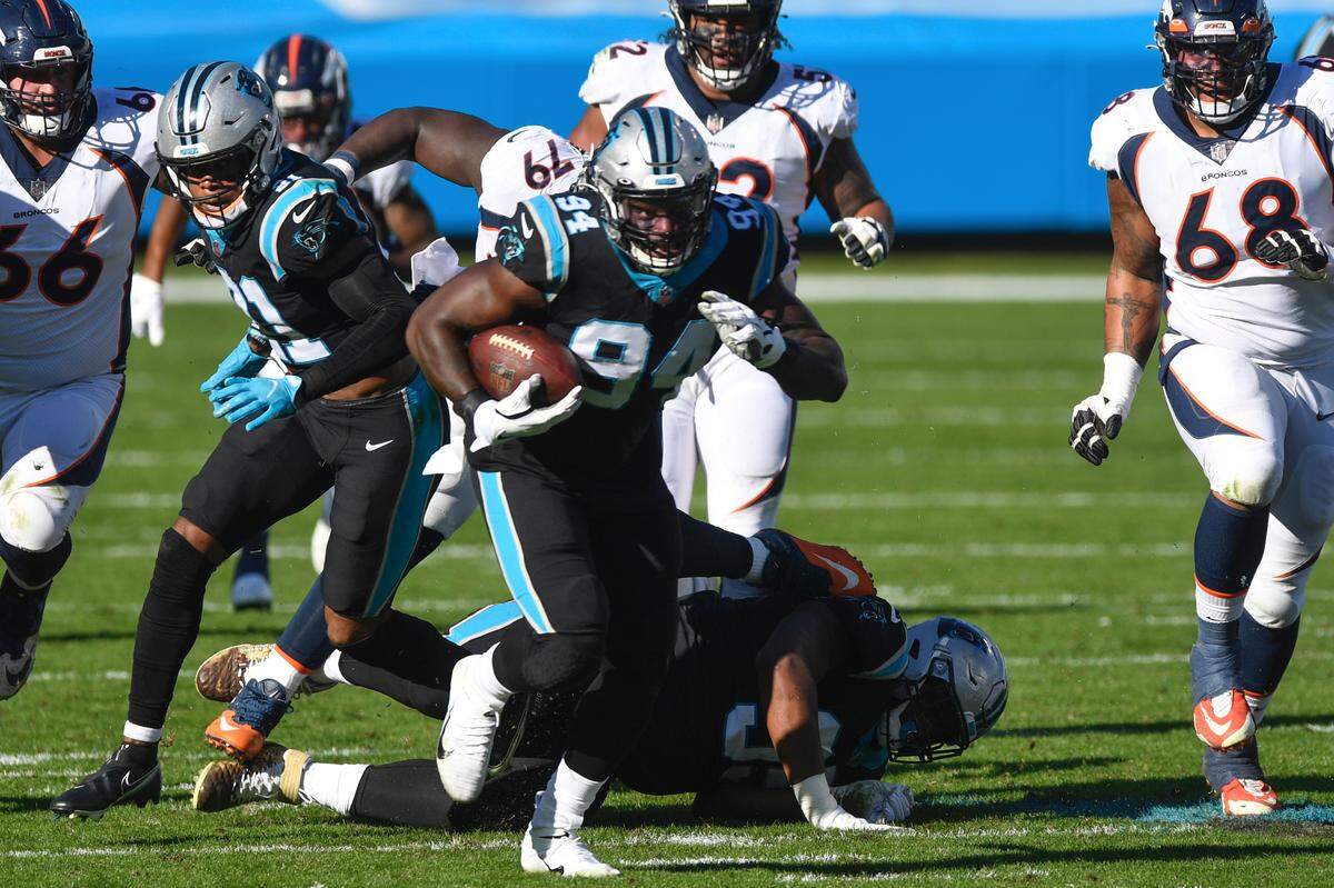 Carolina Panthers defensive end Efe Obada (94) runs for a first down following a fumble recovery during the second quarter of their game Sunday, December 13, 2020.
