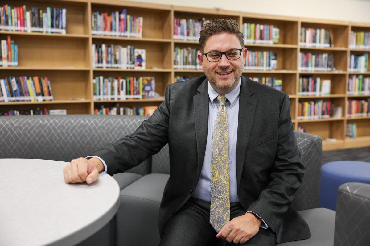 Ballantyne Ridge’s Principal Michael Miliote poses in the school’s library ahead of the new high school’s opening.