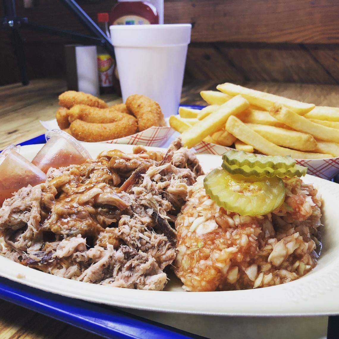 Bar-B-Q King sells 25 pork shoulders, 180 pounds of hamburger and 200 pounds of onions each day.