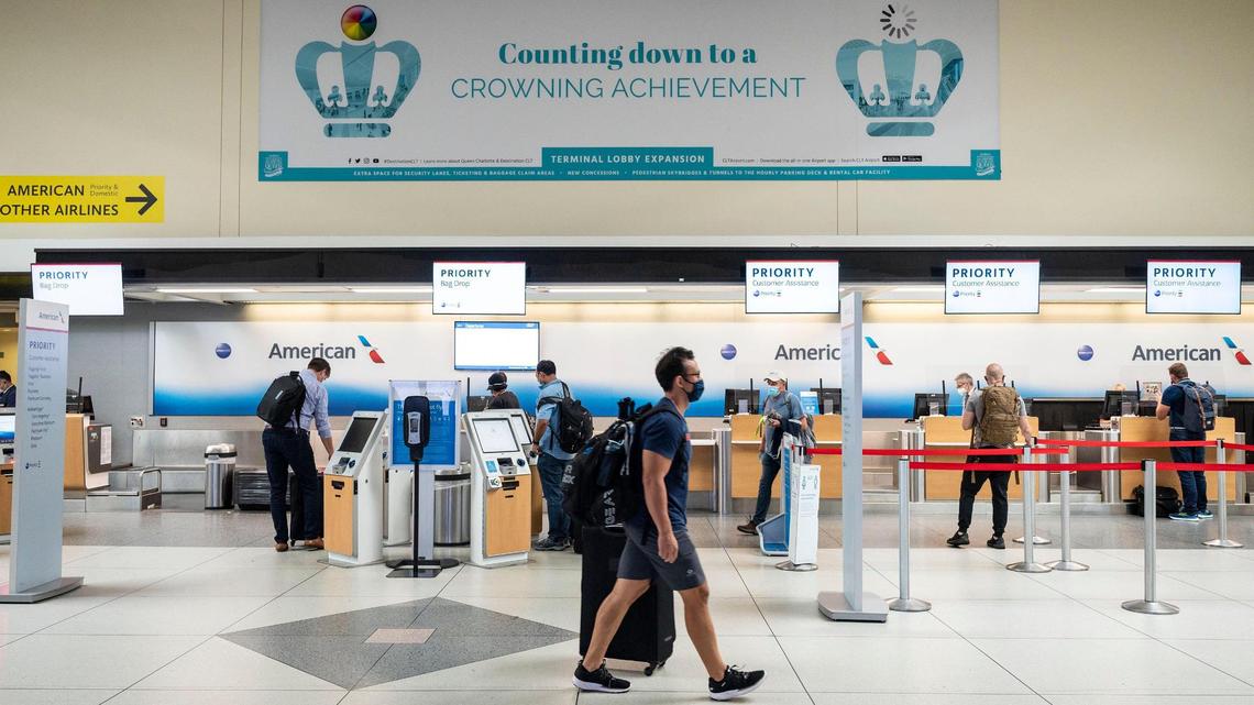 A banner in the American Airlines terminal announces the lobby expansion project at Charlotte Douglas International Airport on Sept. 21, 2021.