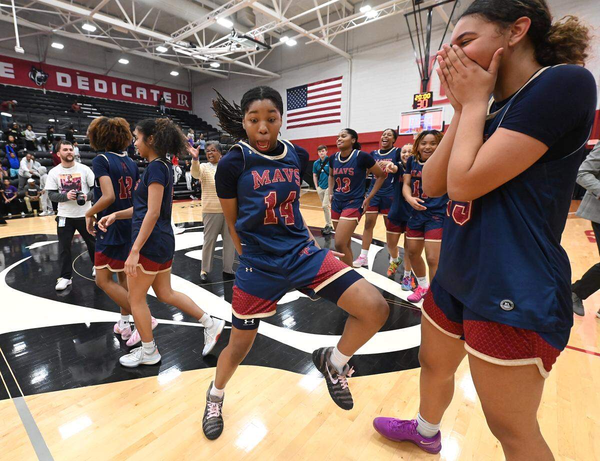 Mallard Creek’s Arianna Gomillion, center, breaks into a dance following the team’s 59-44 win over Ardrey Kell in the NCHSAA 8A girl’s regional championship game on Wednesday, March 4, 2026 at Lenoir-Rhyne University in Hickory, NC.