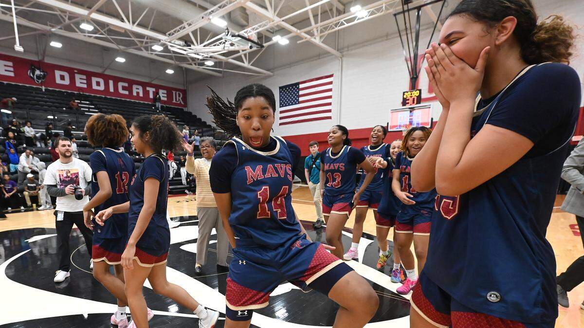 Mallard Creek’s Arianna Gomillion, center, breaks into a dance following the team’s 59-44 win over Ardrey Kell in the NCHSAA 8A girl’s regional championship game on Wednesday, March 4, 2026 at Lenoir-Rhyne University in Hickory, NC.
