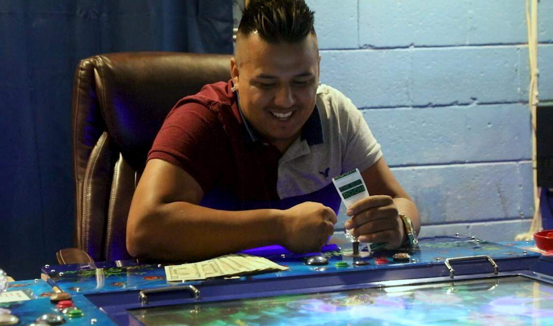 Inside a typical arcade, rows of stand-up arcade machines, computers and fish games cast a colorful glow inside otherwise low-lit buildings. The atmosphere is casual, with upbeat music playing over house speakers.