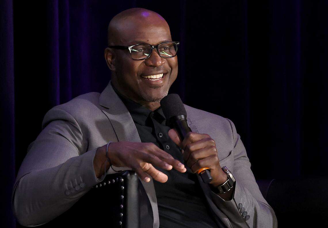 Former Carolina Panthers defensive end Al Wallace laughs as he listens to a story from former defensive end Mike Rucker during the Charlotte Touchdown Club’s Carolina Panthers Kickoff Luncheon on Thursday, August 29, 2024.