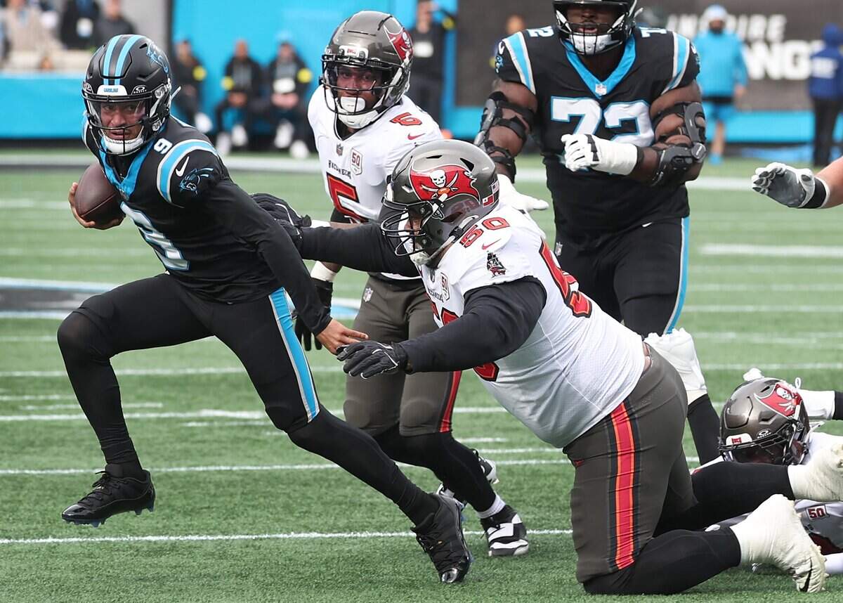 Carolina Panthers quarterback Bryce Young races to the outside with the Tampa Bay Buccaneers defense giving chase during action on Sunday, Dec. 21, 2025 at Bank of America Stadium in Charlotte. The Panthers defeated the Buccaneers 23-20.