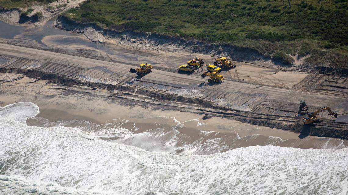 DOT crews clear sand from N.C. 12 on the Outer Banks Saturday, Sept. 7, 2019.