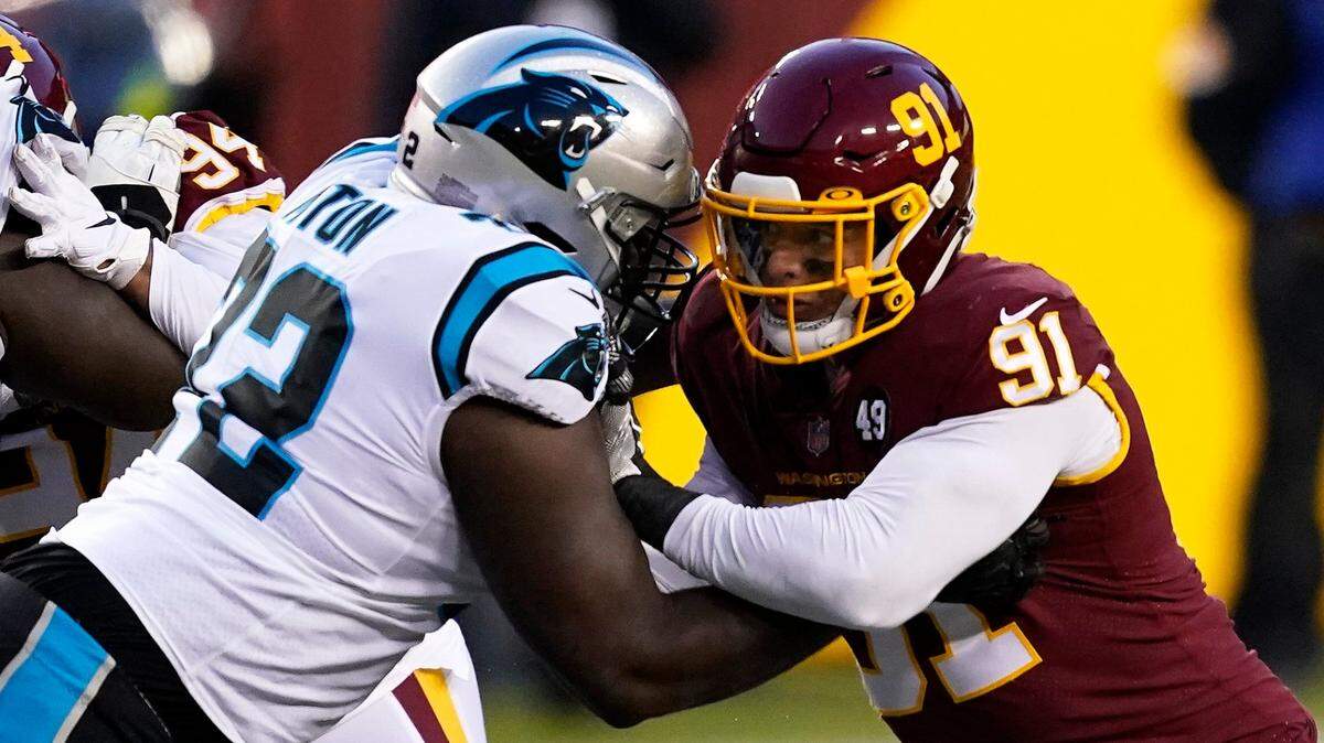 Carolina Panthers offensive tackle Taylor Moton (72) blocks Washington Football Team defensive end Ryan Kerrigan (91) during an NFL football game between the Carolina Panthers and the Washington Football Team, Sunday, Dec. 27, 2020, in Landover, Md. (AP Photo/Mark Tenally)