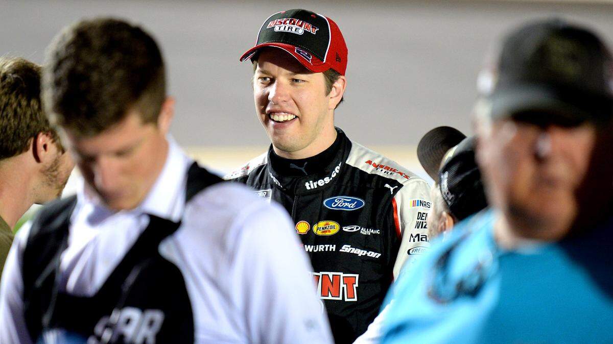 NASCAR driver Brad Keselowski, center, talks with fans along pit road at Daytona International Speedway in Daytona Beach, FL. on Thursday, February 13, 2020