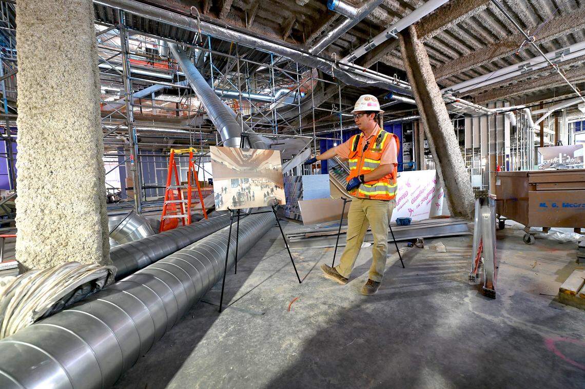 Ben MacBain of Rodgers Builders Inc. discusses the lobby area of the Charlotte Mecklenburg Library’s new Main Library.
