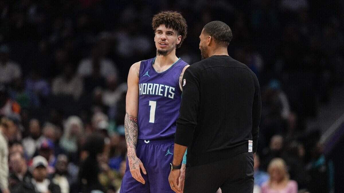 Charlotte Hornets guard LaMelo Ball (1) talks with head coach Charles Lee  during a  free throw during the second half against the New York Knicks at Spectrum Center.