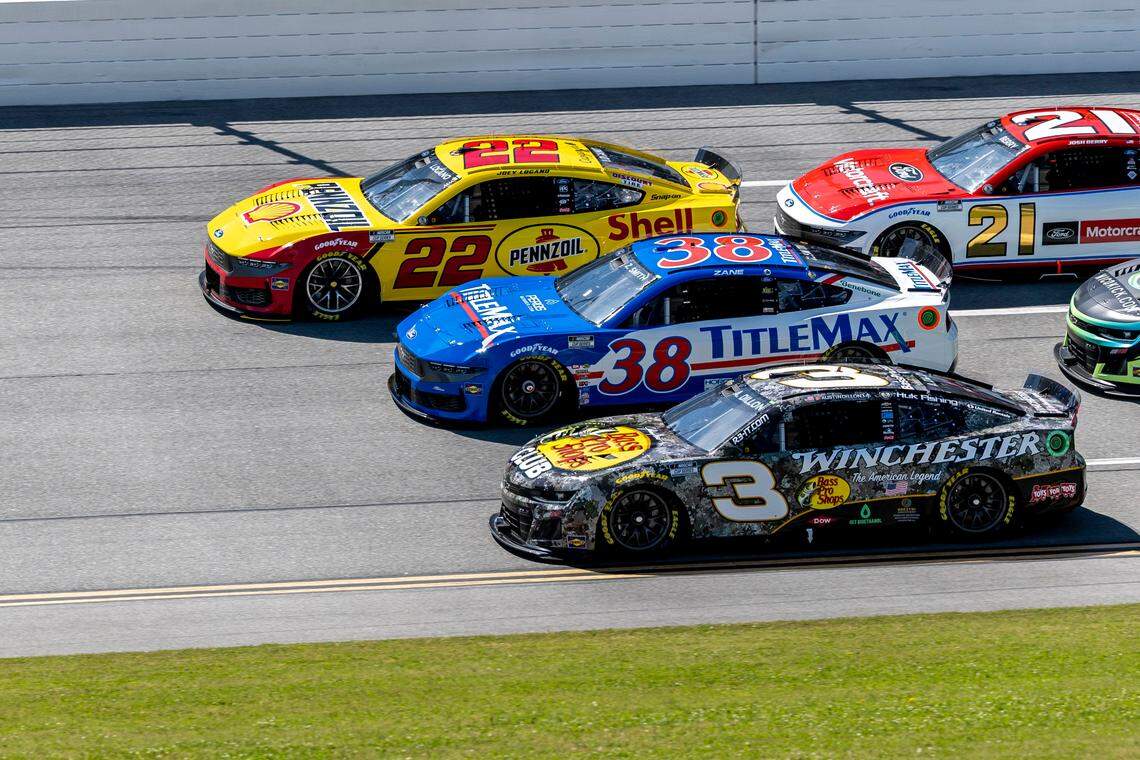 Apr 27, 2025; Talladega, Alabama, USA; NASCAR Cup Series drivers Joey Logano (22) and Zane Smith (38) and Austin Dillon (3) battle for the lead during stage one of the NASCAR: Jack Link’s 500 at Talladega Superspeedway.