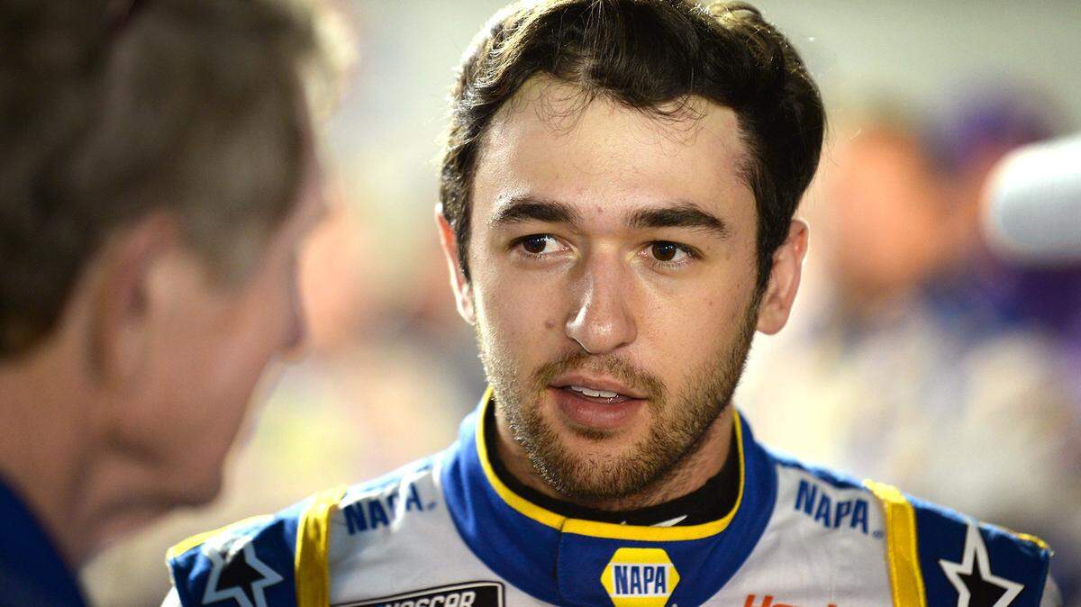 NASCAR driver Chase Elliott waits along pit road with his father, Bill Elliott, left, for the start of the first qualifying race for the Daytona 500 to begin at Daytona International Speedway in Daytona Beach, FL. on Thursday, February 13, 2020