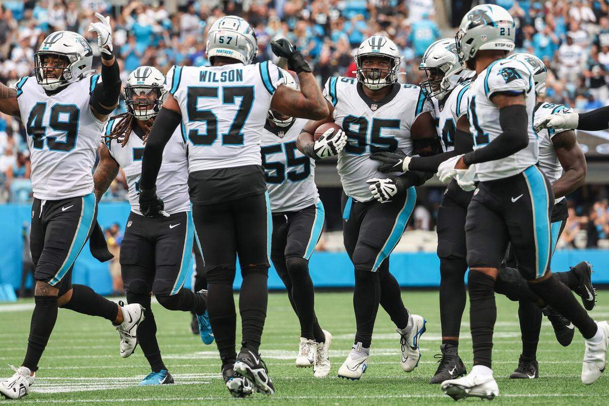 The Carolina Panthers defense celebrates after defensive tackle Derrick Brown (95) recovered a fumble against the New Orleans Saints at Bank of America Stadium on Sunday, September 25, 2022 in Charlotte, NC. The Panthers pulled out their first win of the season by defeating the Saints 22-14.