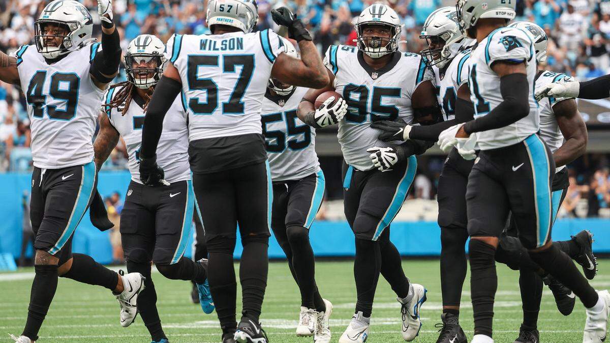 The Carolina Panthers defense celebrates after defensive tackle Derrick Brown (95) recovered a fumble against the New Orleans Saints at Bank of America Stadium on Sunday, September 25, 2022 in Charlotte, NC. The Panthers pulled out their first win of the season by defeating the Saints 22-14.
