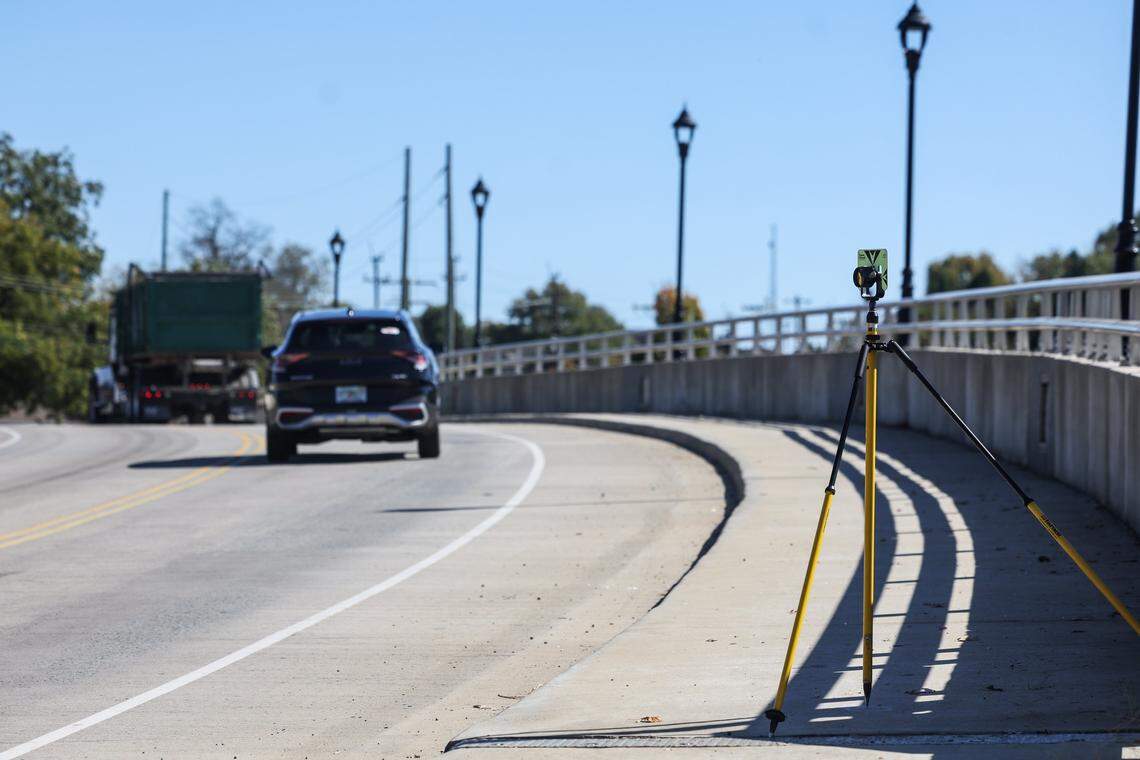 Survey equipment stands on the Oaklawn Avenue bridge over I-77 South in Charlotte, NC on Thursday, October 23, 2025.