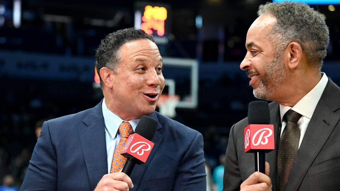 Charlotte Hornets play-by-play sports announcer Eric Collins, left and color commentator Dell Curry, right, returned to the court for their first pregame segment following the pandemic on Wednesday, March 9, 2022. The Charlotte Hornets faced the Boston Celtics in NBA action at Spectrum Center.