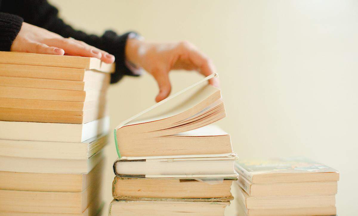 Browse used books outside at the That’s Novel book sale at Camp North End on June 13.