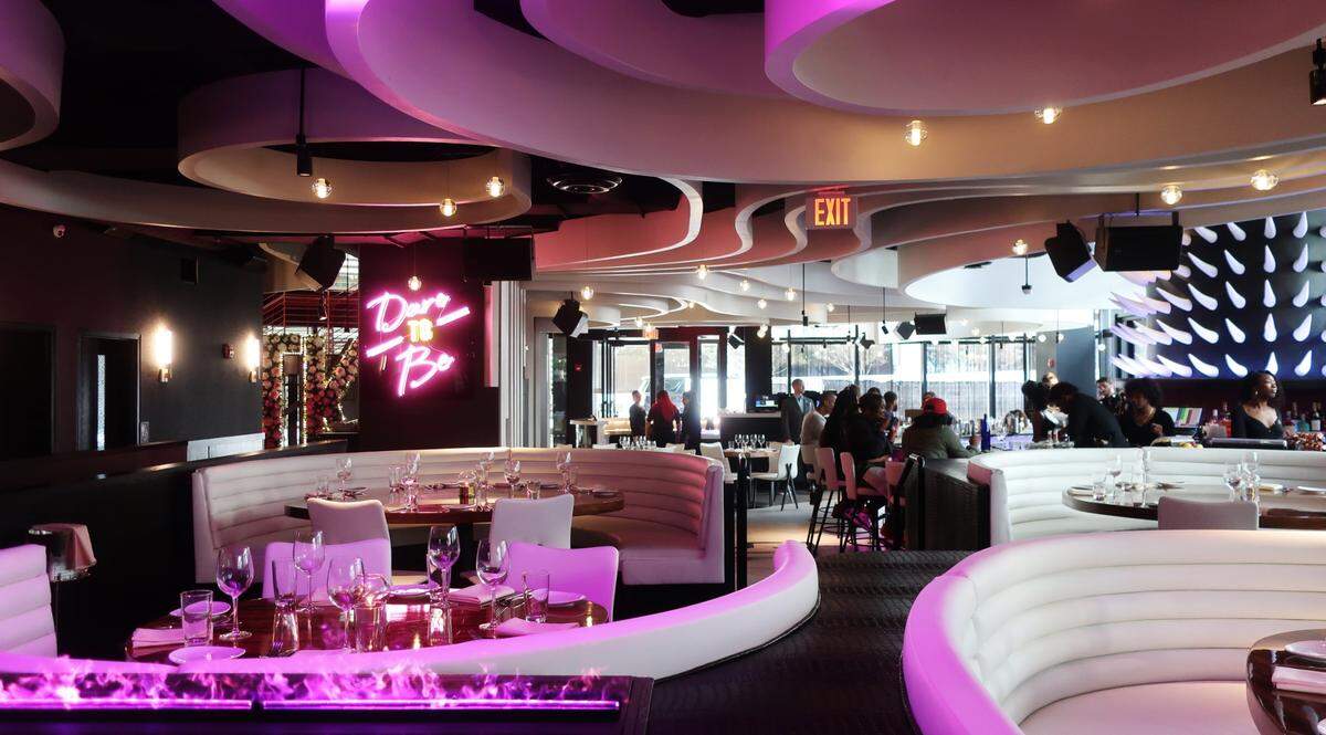 STK Charlotte in uptown Charlotte offers an elevated food experience, including steak and seafood, cocktails and DJs spinning music.