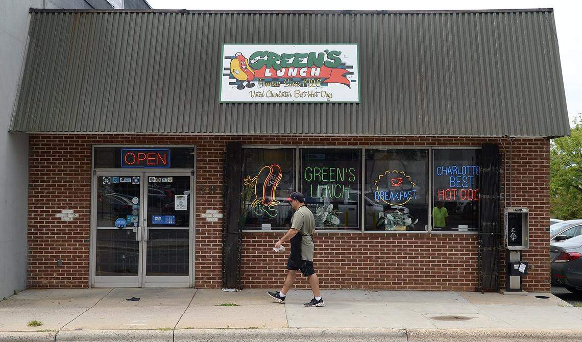Andreas Arethas, 42, a cousin of the Sikiotis family, returns to Green’s Lunch after hand delivering an order to a waiting customer in the parking lot in 2022.