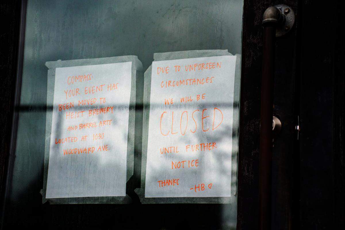 Signs posted on the Heist Brewery NoDa location’s doors on July 19, 2024, three days after the fire occurred.