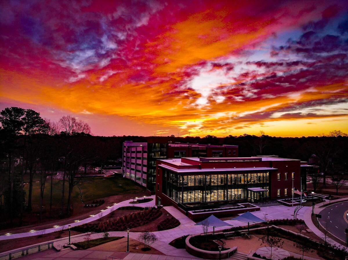 The sun sets over the Cary Regional Library in Cary, North Carolina.