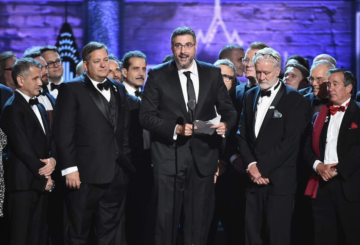 Orin Wolf (center) and the cast and crew of “The Band’s Visit” accept the award for Best Musical during the 2018 Tony Awards show.