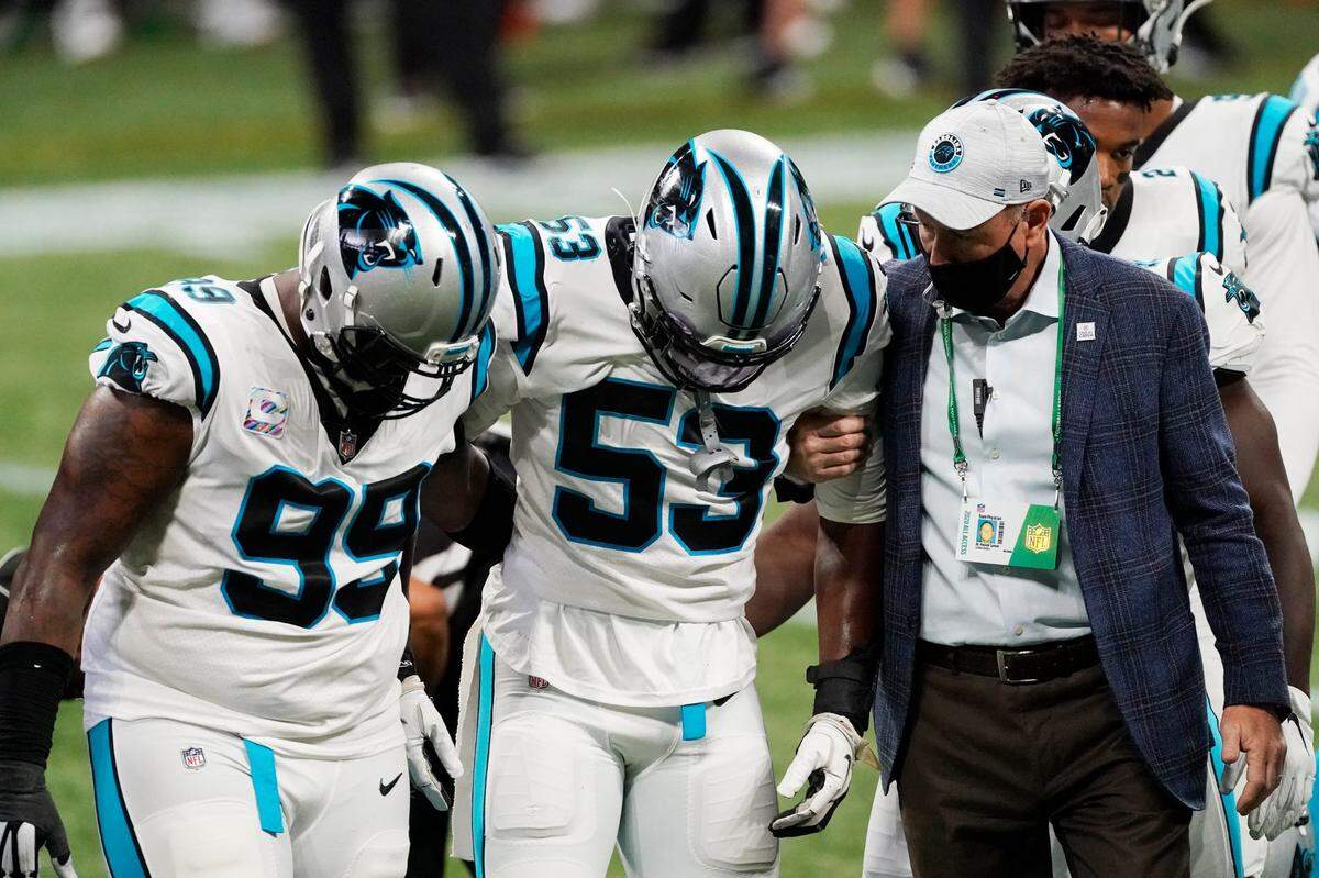 Carolina Panthers defensive end Brian Burns (53) is helped after injury against the Atlanta Falcons during the first half of an NFL football game, Sunday, Oct. 11, 2020, in Atlanta. 