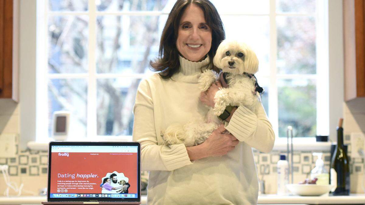She didn't own a dog until her 40s. She's not really a tech person. She's happily married. Who better than Cindy Himmel, 67, to develop a dating app for dog lovers? After spending several years developing it, the app, Frolly, went live just over one month ago.

Himmel sat for photos with her two rescue dogs Ruby, 17 and Lulu, 13, on Friday, Dec. 05, 2025.