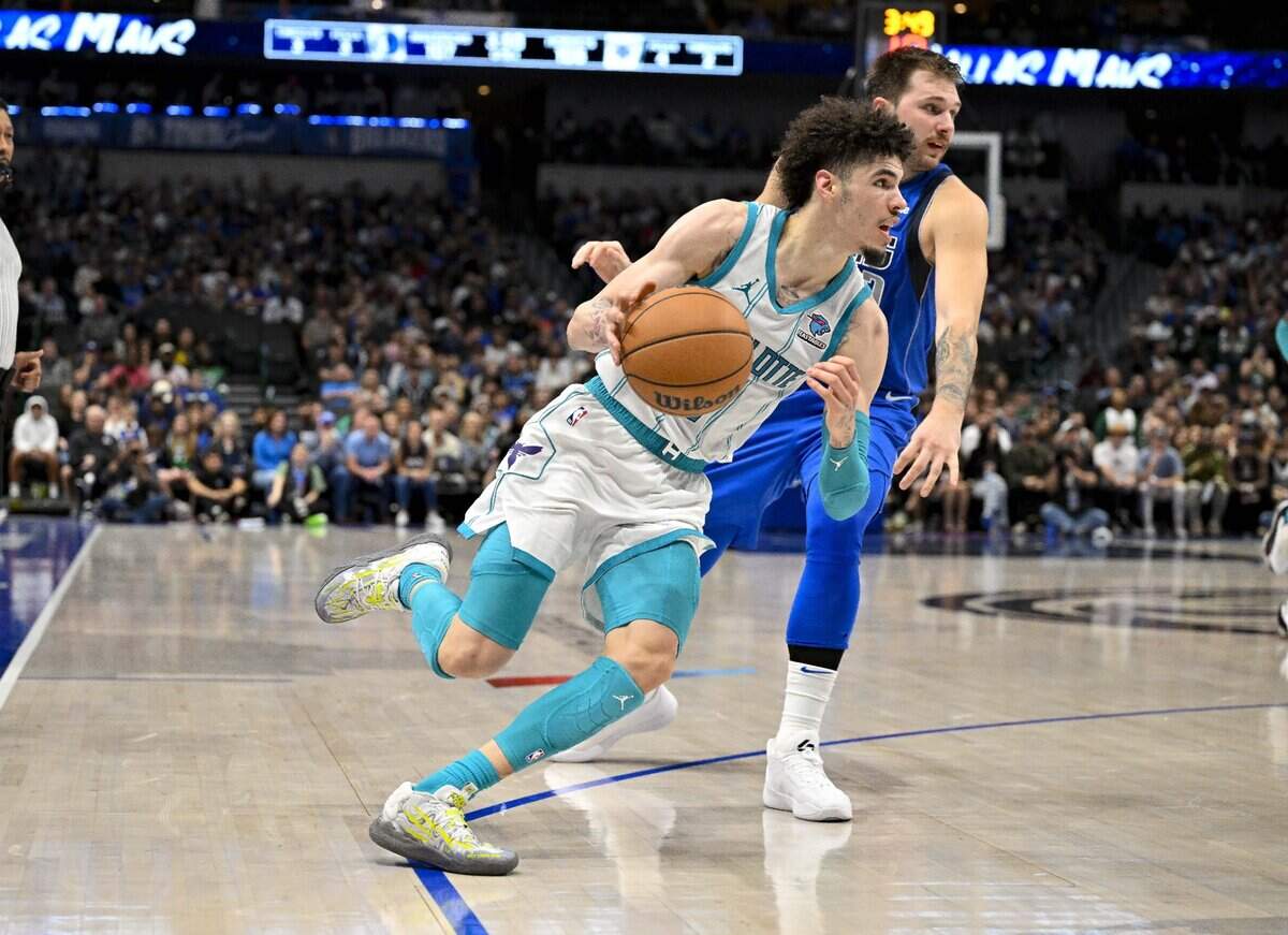 Charlotte Hornets guard LaMelo Ball (1) drives to the basket past Dallas Mavericks guard Luka Doncic (77) during the second half at the American Airlines Center.