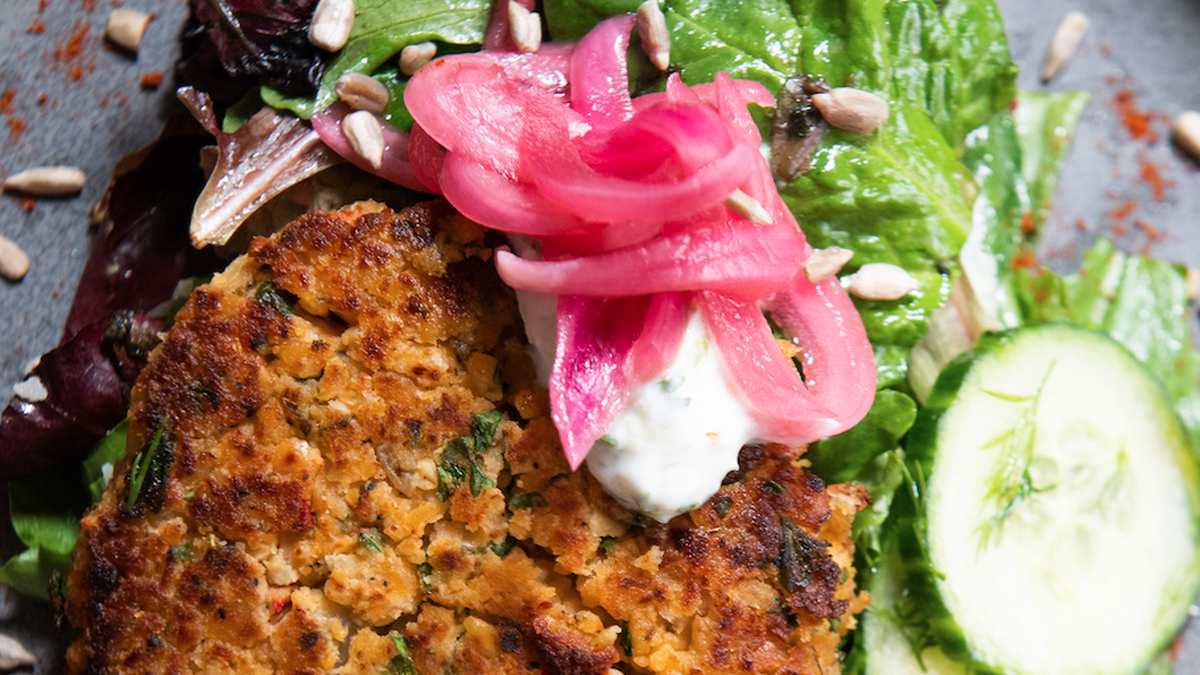The Roots Chickpea Veggie Burger ($11) is house made and comes with fresh greens, feta, pickled onion, cucumber, lavender tzatziki and citrus vinaigrette.