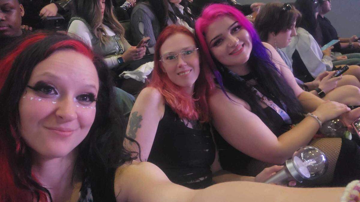Aespa fans wait for the concert to start at the Spectrum Center in Charlotte.