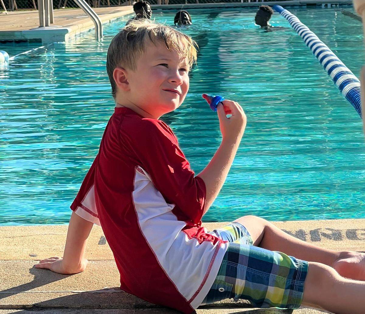 Cole Mauney enjoys a ring pop at the Coulwood Hills Swim Club.