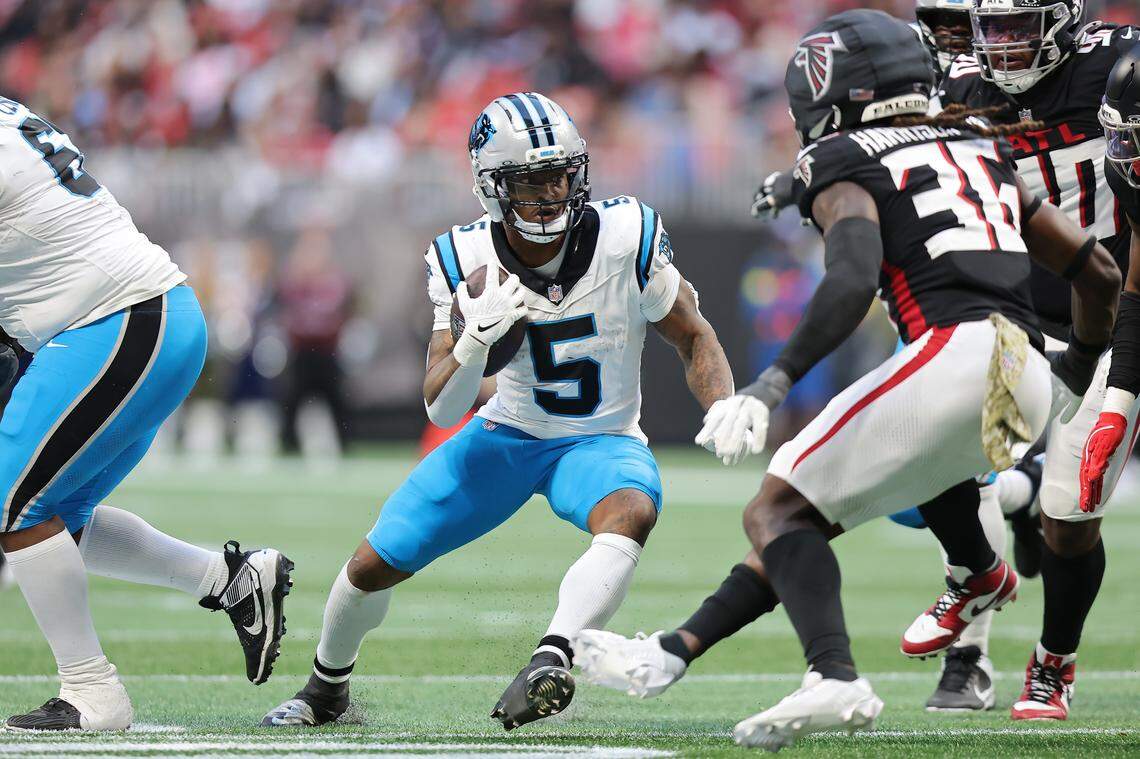 Rico Dowdle of the Carolina Panthers runs the ball after a catch during Sunday’s third quarter against the Atlanta Falcons at Mercedes-Benz Stadium in Atlanta.
