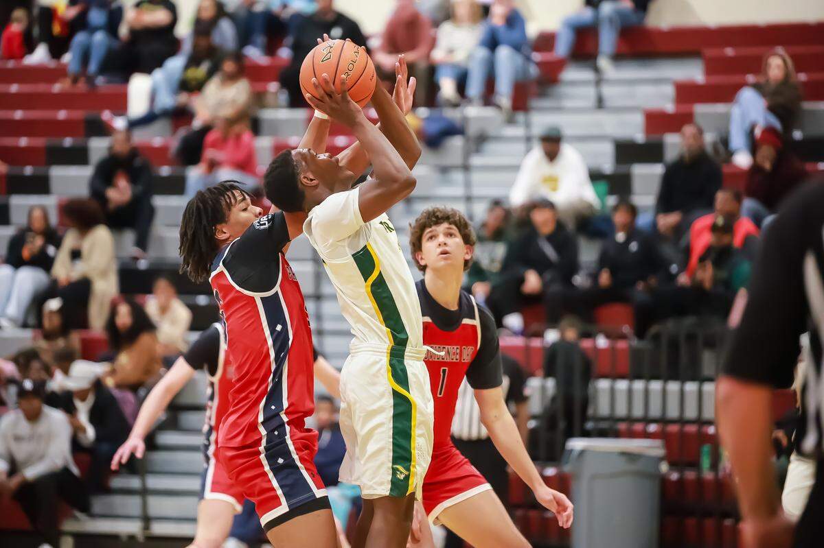 Independence High’s Christian Jones goes up for a shot against two Providence Day defenders during the Charlotte Hoops Challenge on Nov. 29, 2025, at Harding High School.