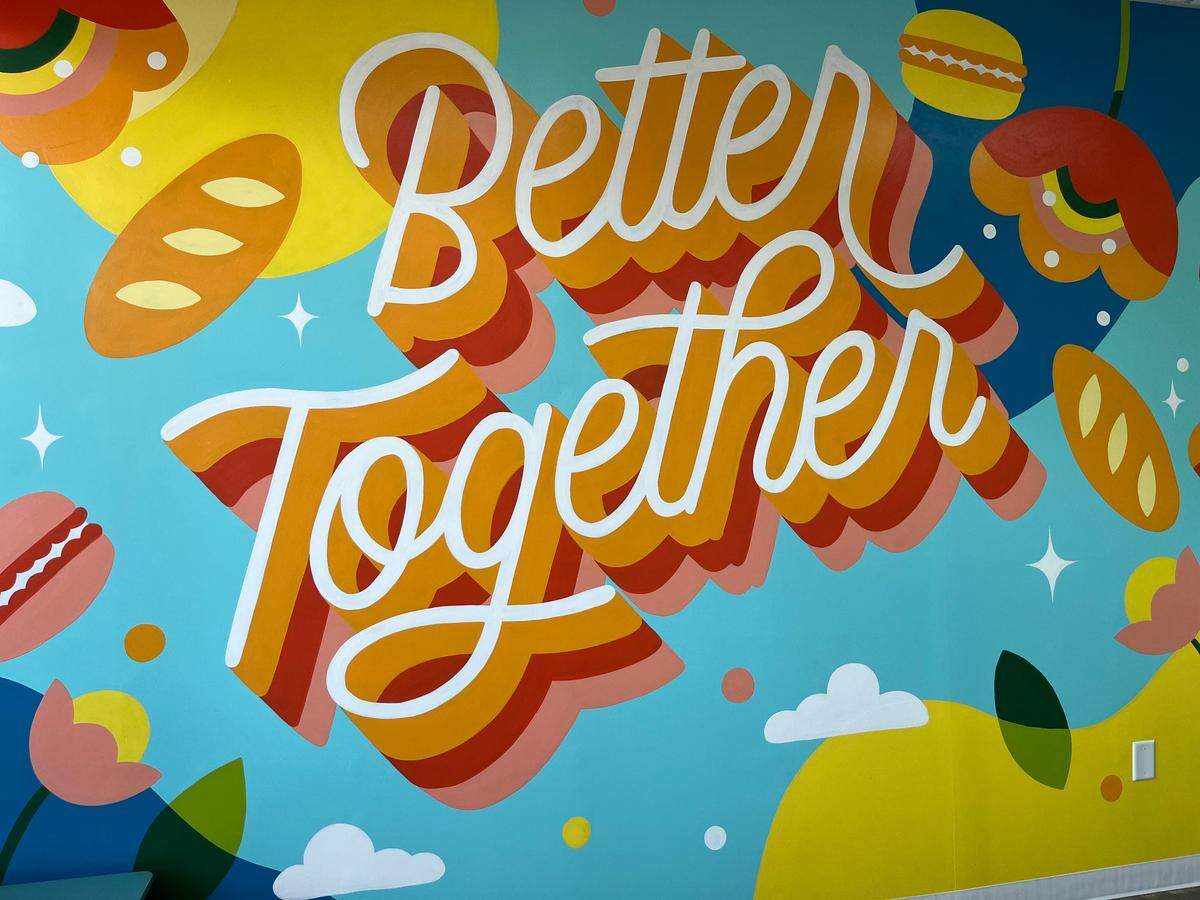 A bright, inviting mural by New York artist Steffi Lynn Tsai sets the tone for the space.