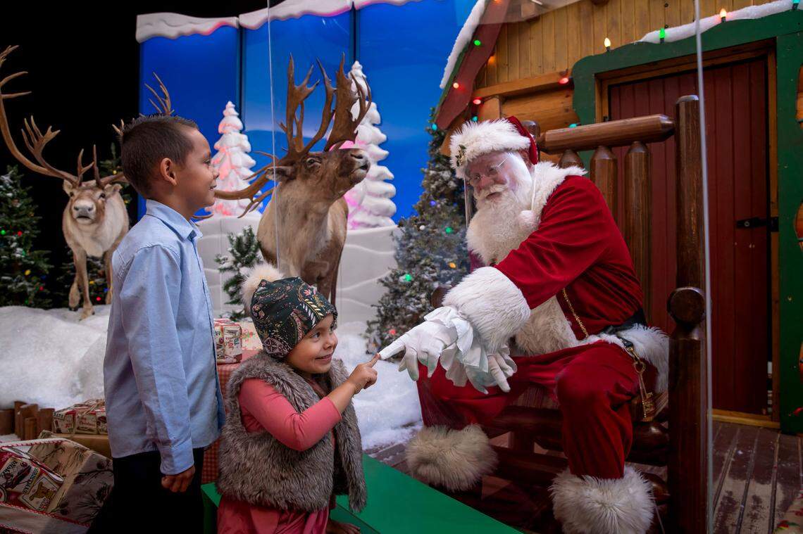 Clear barriers will separate Santa Claus from families this year amid the COVID-19 pandemic at Bass Pro Shops and Cabela’s stores.