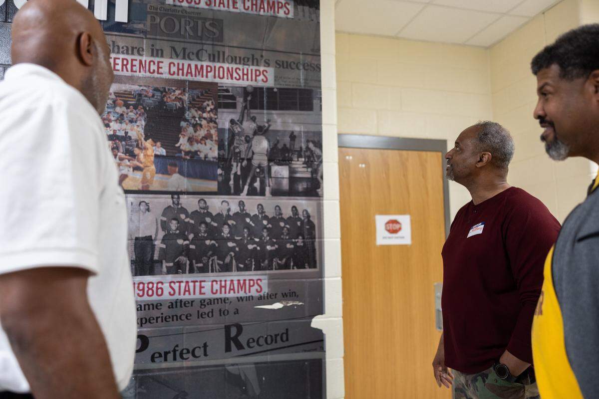 West Charlotte 1986 State Championship basketball players, Jules Springs, from left, Duane Montgomery and Maurice Caldwell pose for a portrait at West Charlotte High School in Charlotte, N.C., on Monday, March 9, 2026. 