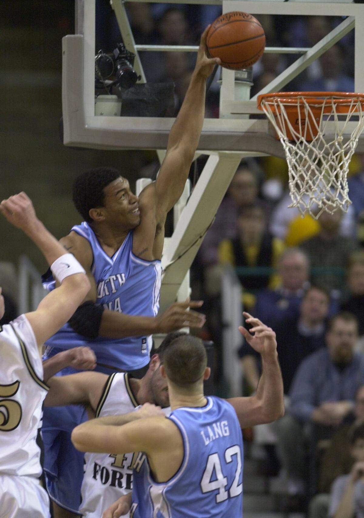 UNCWAKE7.SP.020601.TSS--WINSTON SALEM--UNC’s Julius Peppers goes high over the rim to dunk in late second half action against Wake Forest, Tuesday, Feb. 6,2001.
