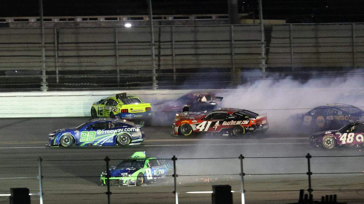NASCAR Cup Series driver Ryan Blaney (12), driver Joey Logano (22) and driver Kyle Busch (8) wreck on the back stretch during the Daytona 500 at Daytona International Speedway. Mark J. Rebilas-Imagn Images